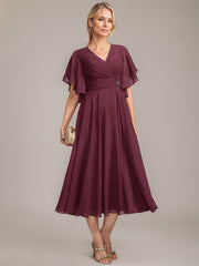 A-line V-Neck Tea-Length Chiffon Mother of the Bride Dress With Pleated Beading